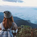 backpack-bonnet-clouds-daylight-foggy-landscape-looking-mountains-outdoors-people-plants-sky-travel-women-1500677
